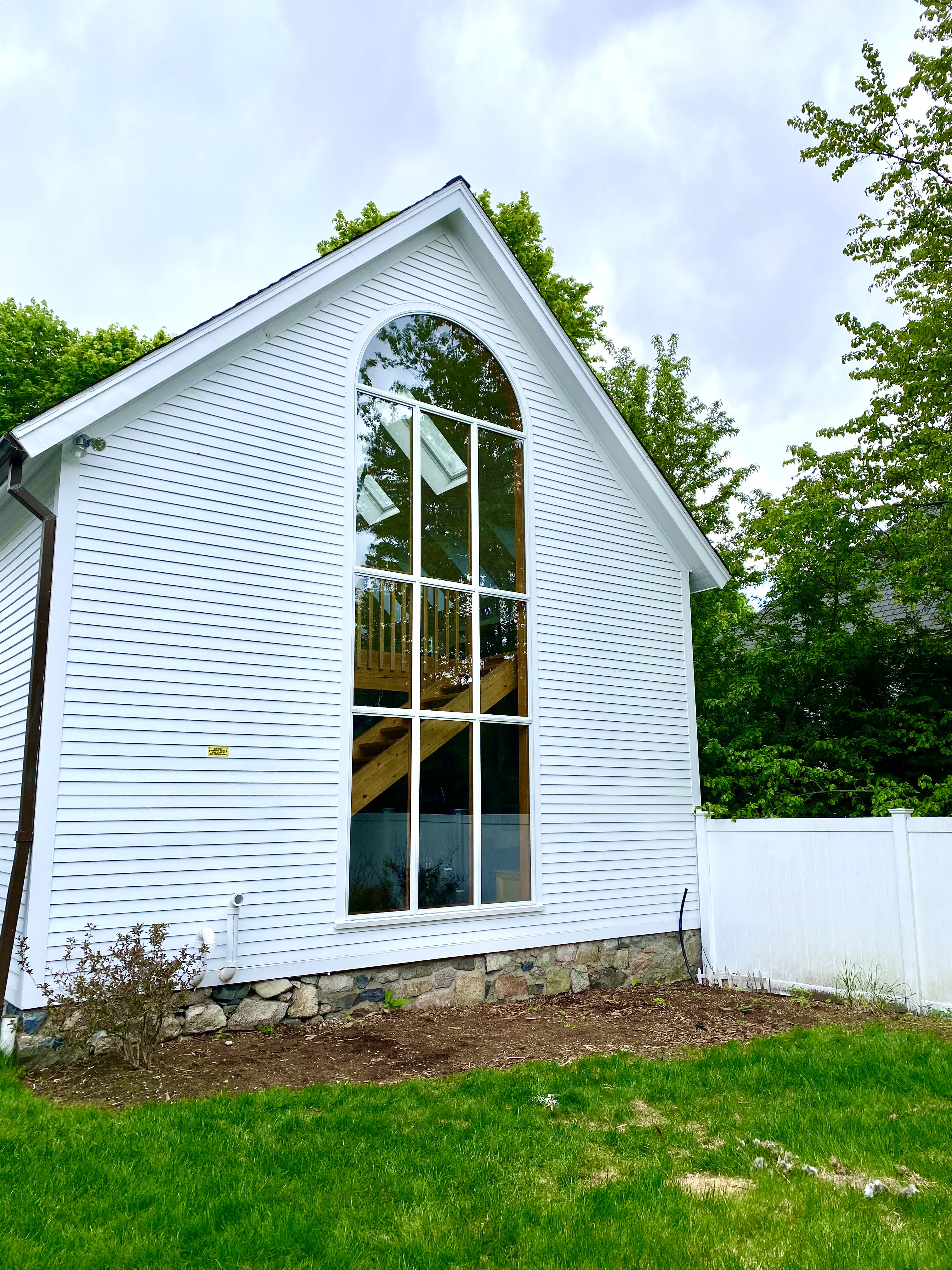 Home addition with arched window